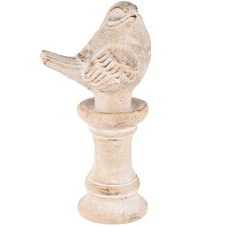 Bird on pedestal